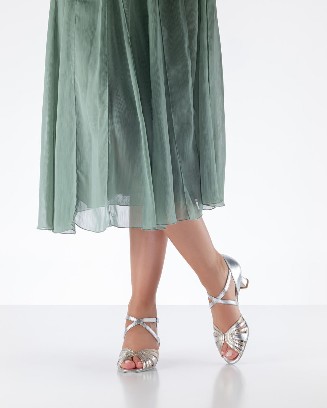 Ginger dance sandals in silver with a 5.5 cm flared heel, worn with a mint-coloured skirt
